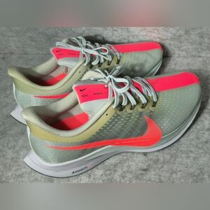 Nike Zoom Pegasus 35 running shoes in grey with bright pink accents. Lightweight